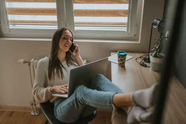 istock Young woman freelancer working from home 1211443733