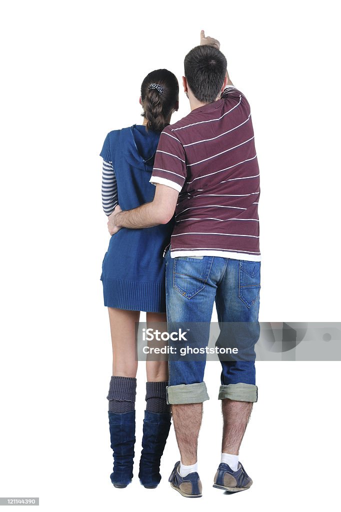 Jovem casal parece onde. Vista traseira. - Foto de stock de Abraçar royalty-free