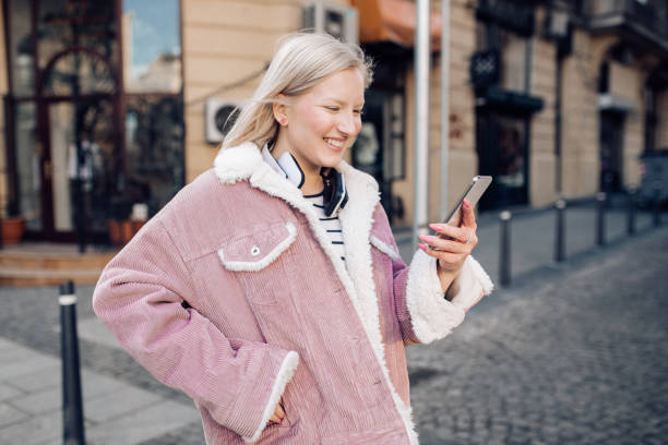 istock Student girl standing on the street 1211444785