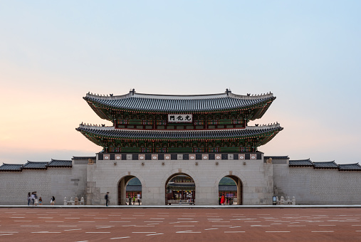 Seoul, Republic of Korea - June 20, 2019: GwangHwamun at sunset, main gate to Gyeongbokgung Palace, the main & most important royal palace during Joseon Dynasty, Seoul, South Korea. Historic site, heritage and tourist attraction.