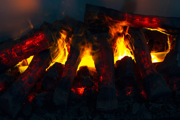 istock Bright fire in the fireplace close up. House 1211449417