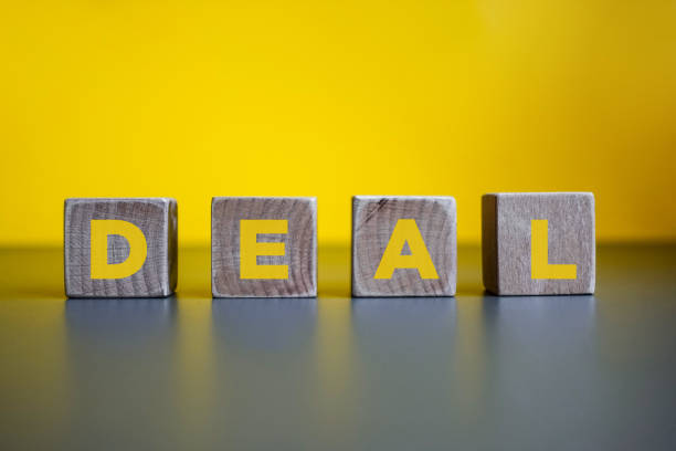 istock DEAL, Wood Blocks on Yellow Background. 1211451049