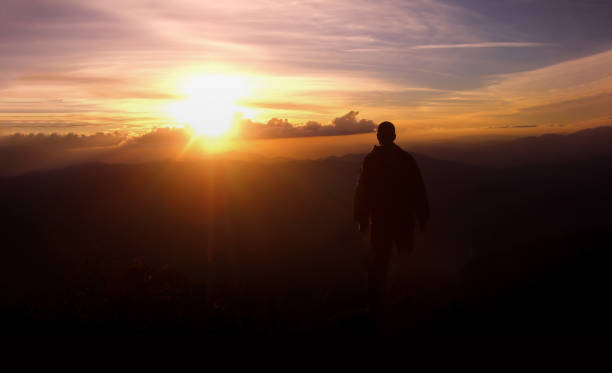 istock A man in the top of a mountain looking 1211455045