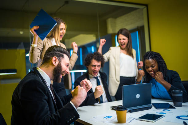 istock Business team employees celebrating success 1211455167