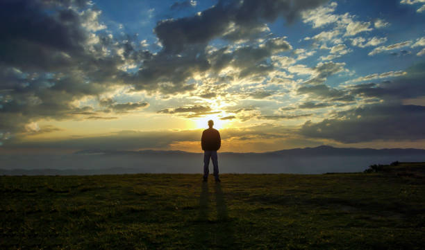 istock A man in the top of a mountain looking 1211455186