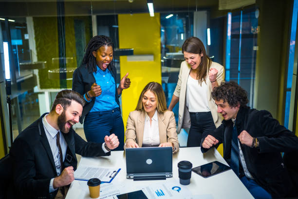 istock Business team employees celebrating success 1211455246