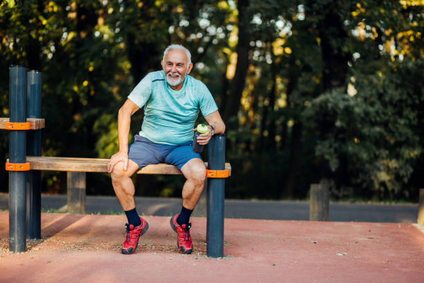 istock Senior man holding a bottle of water 1211456977