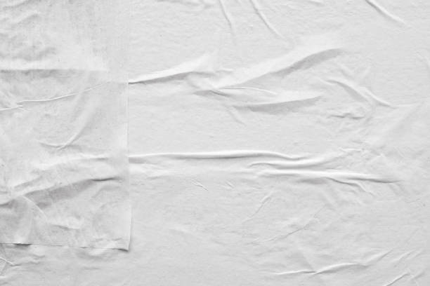 istock Blank white crumpled and creased paper poster texture background 1211457076