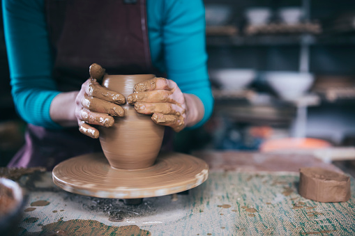 Close Up Image Of Female Potters Hands Making Vase