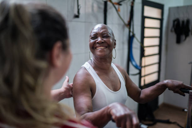 istock Happy senior woman doing physical therapy 1211457529