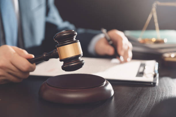 istock Lawyer, attorney with gavel at work. Law concept 1211457573