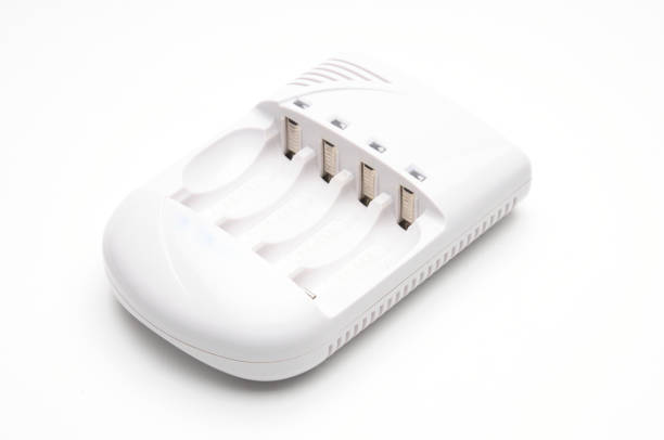 istock Adapter for charging batteries on a white background 1211459345