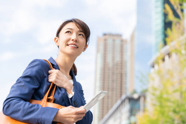 istock asian woman who see a tablet computer 1211463613
