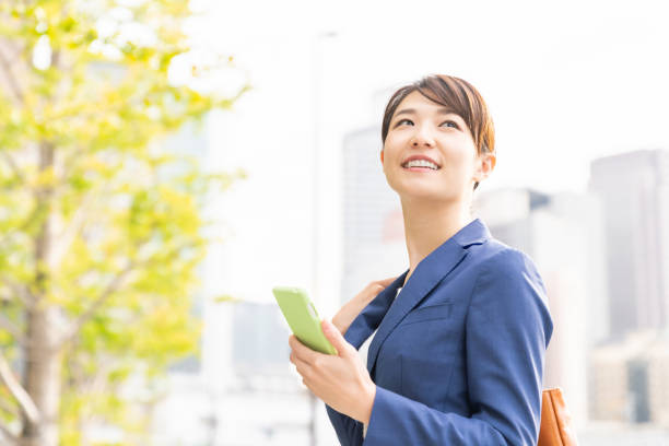 istock asian woman who see a smart phone 1211463683