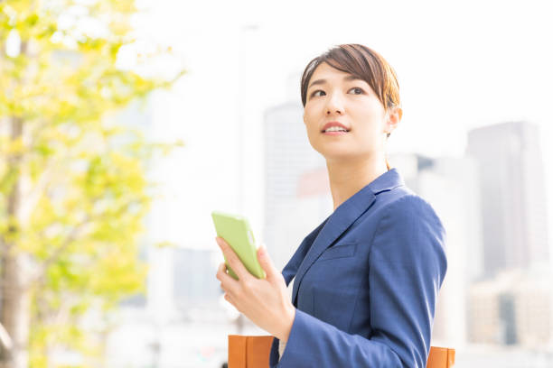 istock asian woman who see a smart phone 1211463771