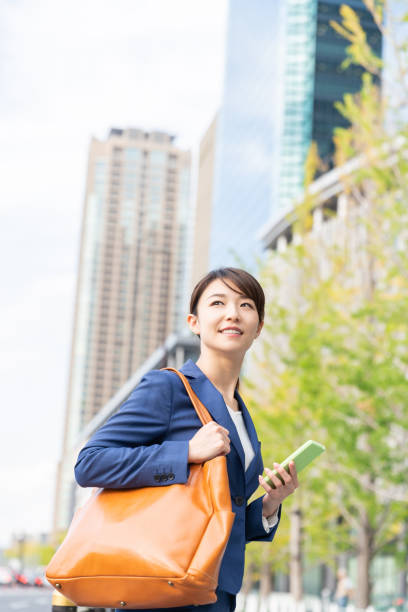 istock asian woman who see a smart phone 1211463779
