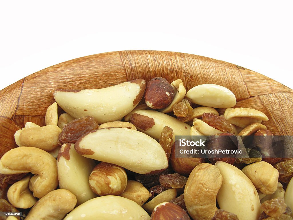 Frutta secca mista snack cibo in legno piatto - Foto stock royalty-free di Alimentazione sana
