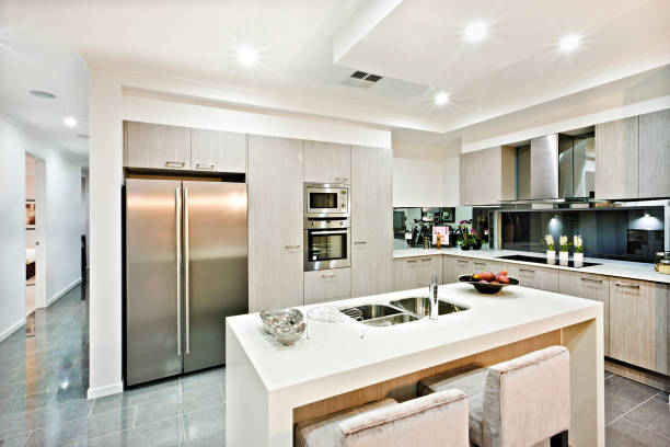 istock Modern kitchen counter top with a fridge and pantry 1211471086