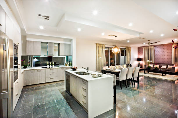 istock Modern and shiny kitchen with dining and living area 1211471199