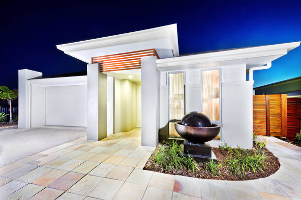 istock Luxury mansion front side tiles floor and waterfall pond 1211471937