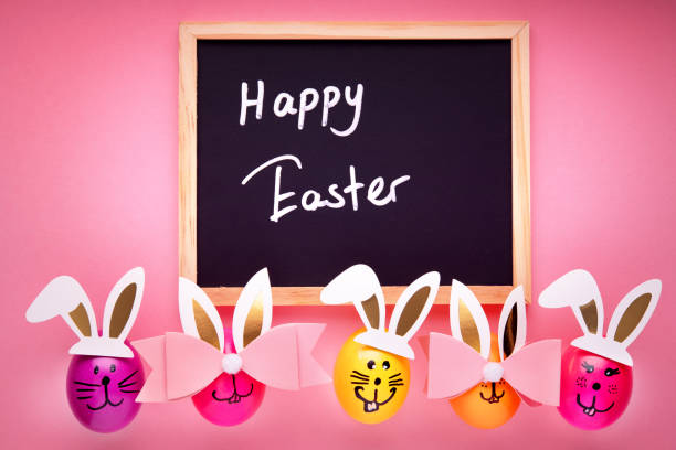 istock Easter decoration on pink background with happy easter text 1211476687