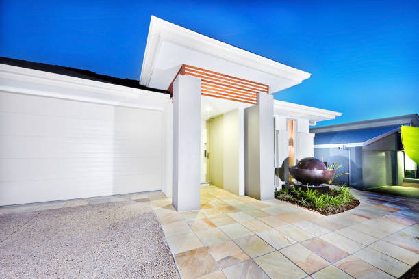 istock Luxury mansion front side with white walls and garage 1211478935