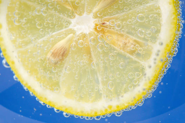 istock close-up of a lemon fruit, background in water, under water. background, texture 1211479107