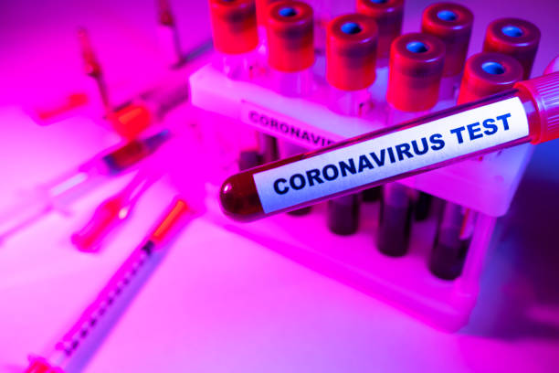istock Coronavirus blood test concept. Analyzing blood sample in test tube for coronavirus test. Test tube with blood for 2019-nCoV analyzing. Coronavirus blood analysis concept. 1211481705