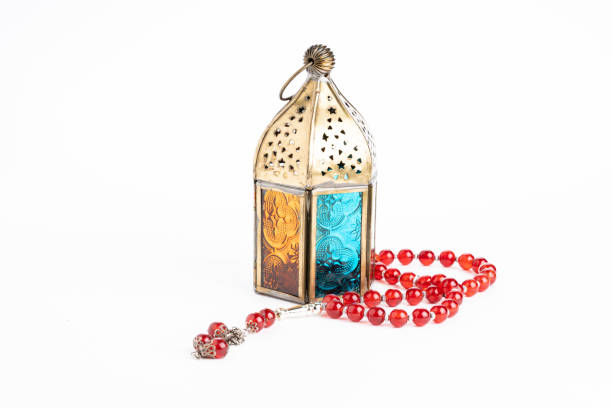 Arabic lantern and tasbih (rosary beads) isolated against white