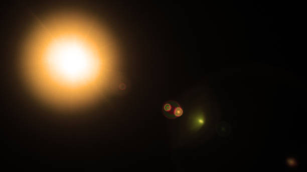 istock Abstract Natural Sun flare or Far star on the black background 1211494546