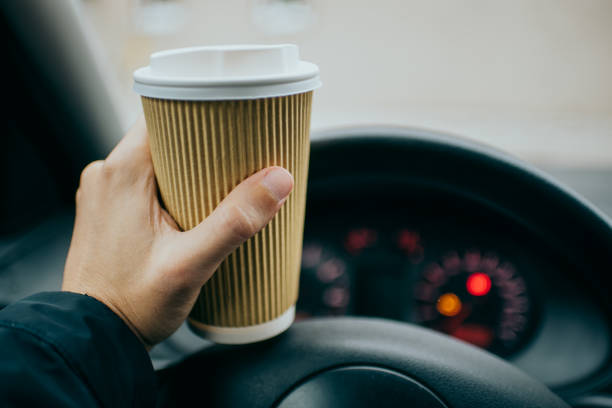 istock Holding a cup of a drink 1211494660