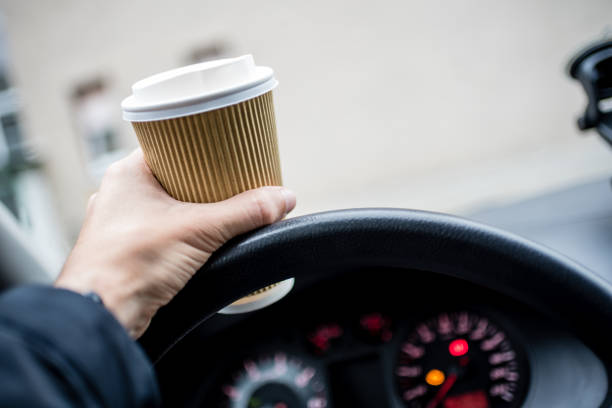 istock Holding a cup of a drink 1211494661