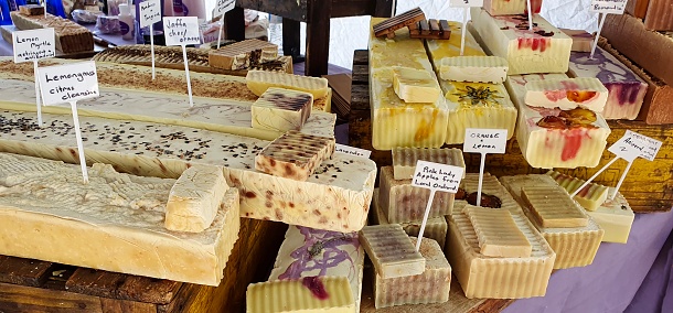 Display of handmade soaps at a local market.