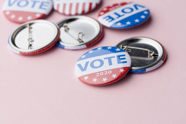istock Vote election badge button for 2020 background, vote USA 2020 1211495568
