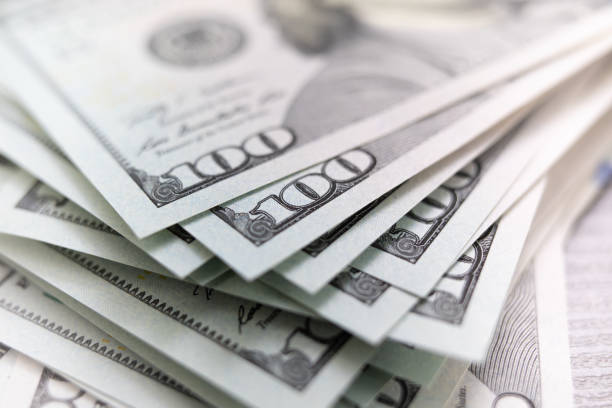 stack of dollars spread out stack of dollars spread out us currency photos stock pictures, royalty-free photos & images