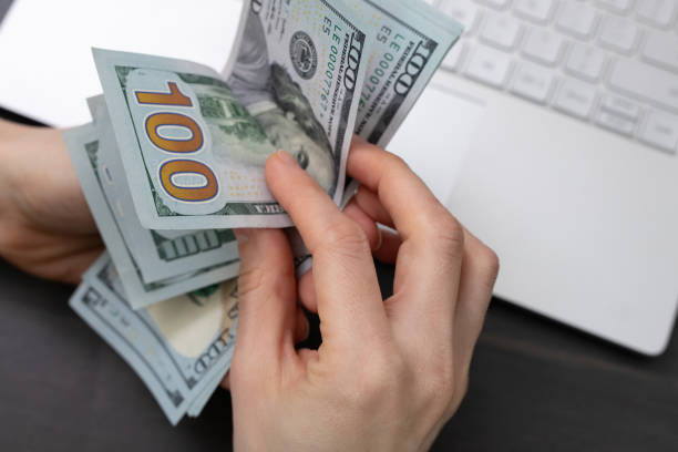 istock man recounts bills in hand 1211495748