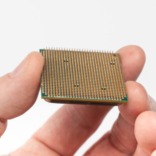 istock the microprocessor is held by the fingers of the hand 1211495970
