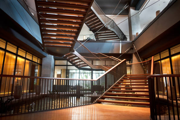 curving staircase in modern home interior - corridor entrance hall floor hardwood imagens e fotografias de stock