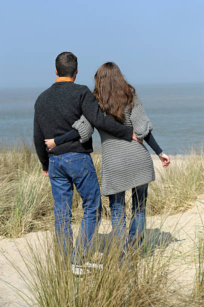 istock young happy couple at the beach 121149806
