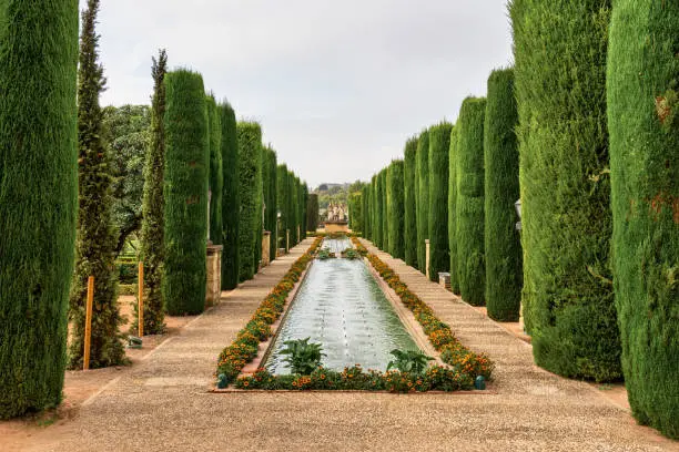 View of the gardens of the Alcazar of the Christian Monarchs, Alcazar de los Reyes Cristianos in Cordoba, Andalusia, Spain