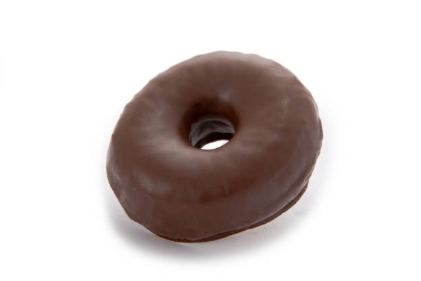 istock Chocolate donut isolated on white background. 1211501616