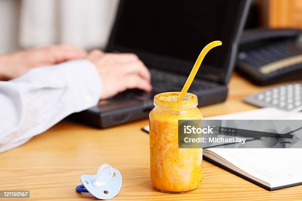Working Parent Concept With Baby Food In The Office Stock Photo - Download Image Now