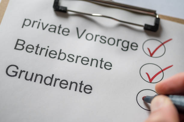 istock basic pension as the first pillar of old-age provision presented as a list on a clipboard with the words basic pension, company pension and private provision in german 1211502025