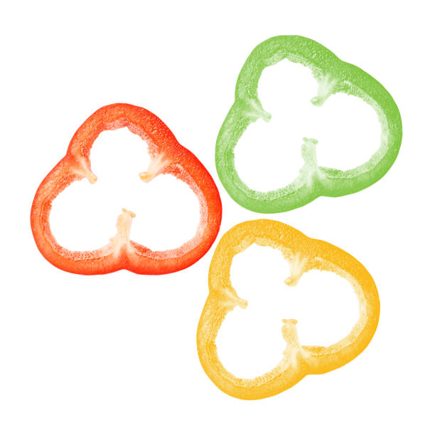 istock Three multi-colored slices of bell pepper on a white isolated background 1211502246