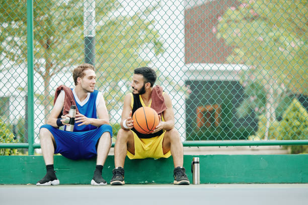 istock Sportsmen discussing basketball game 1211503530