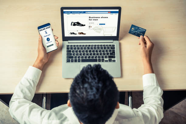 istock Young man use credit card for online shopping 1211504641