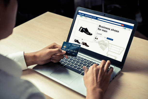 istock Young man use credit card for online shopping 1211505314
