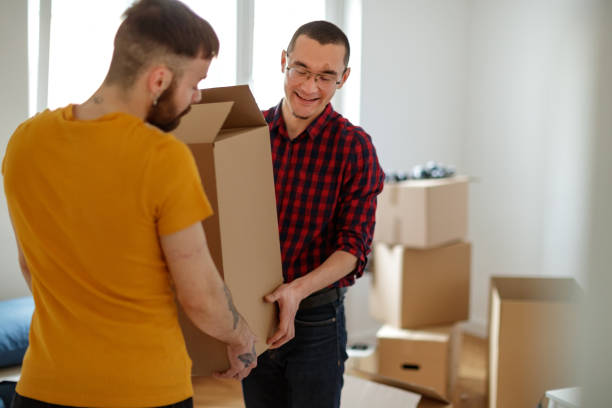 istock Gay couple moving in 1211507089
