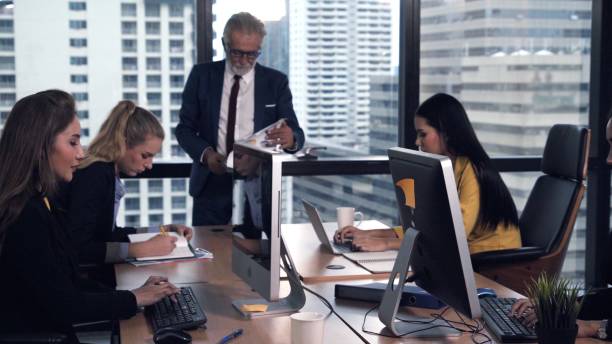 istock Senior leader giving advice speech to team members 1211507230