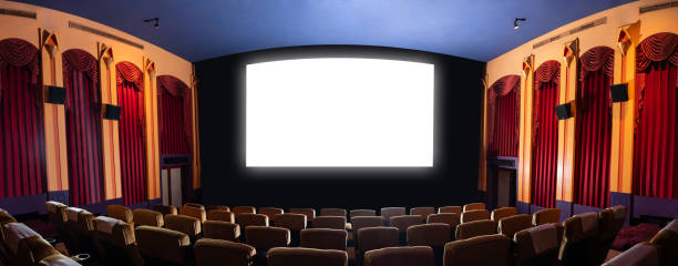 istock Cinema theater showing empty white movie screen. 1211508148